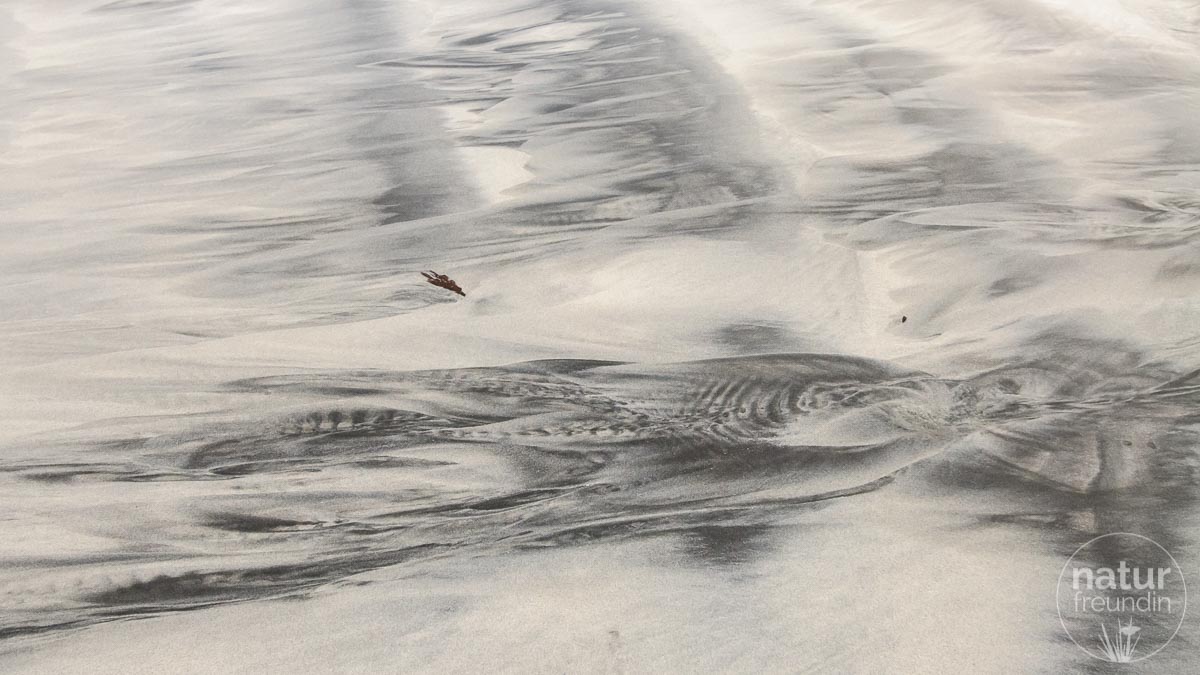 Sandbild am Strand von Leknes